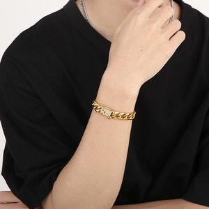Men's 18k gold plated Cuban link bracelet with iced out diamond clasp on wrist