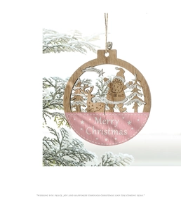 Detailed laser-cut wooden Christmas ornament with pink finish and silver bell accent