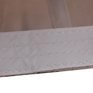 Close-up of triple-stitched reinforced sweatband on khaki cotton baseball cap