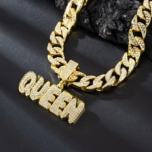 Iced out gold QUEEN pendant with Cuban link chain in heavy hip hop style for women