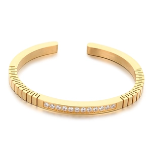 Golden stainless steel C-shaped open bangle with zircon inlay and vertical textures