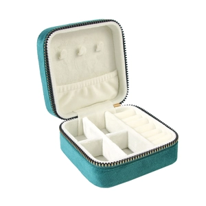 Teal velvet jewelry organizer travel case with golden zipper and multi-compartment interior