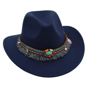 Detail of ethnic hat band featuring turquoise bead, wooden accents and grey tassels