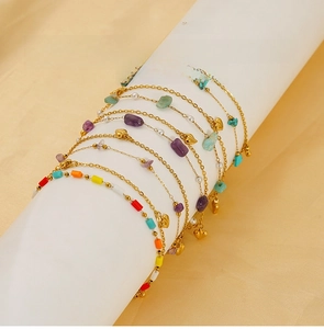 Detail of stainless steel natural stone bracelets with heart charms and colorful beads