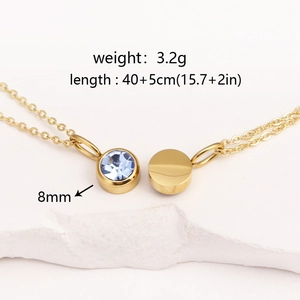 Detailed view of gold necklace with blue stone pendant showing 40+5cm length and 8mm size