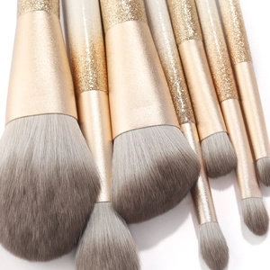 Champagne gold glitter makeup brush set with soft dual-tone synthetic bristles for makeup