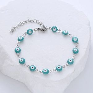 Detail view of turquoise evil eye beaded stainless steel bracelet with lobster clasp