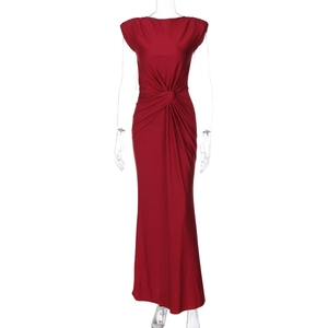 Detail of red sleeveless maxi dress showing elegant waist twist and ruched pleats