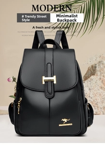 Close-up of black lychee grain leather backpack with gold kangaroo logo and metal clasp