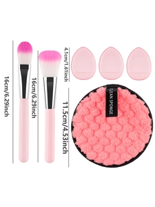 Detailed view of makeup brush set with thumb puffs and clean sponge on white backdrop