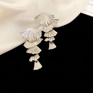 Silver cascading tassel earrings with five layered fan charms in high-shine metal finish