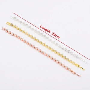 Set of three fashion zircon bracelets in gold, silver, and rose gold with heart design