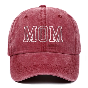 Close-up of vintage washed burgundy cotton baseball cap with white MOM embroidery