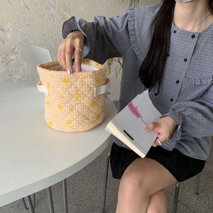Cute yellow checkered quilted storage basket with smile face print and carry handles