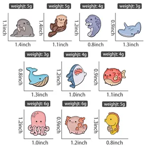 Detailed size and weight chart for enamel pins featuring diverse sea animal designs