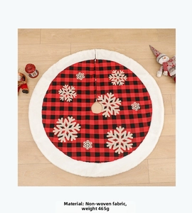 Detail of red buffalo plaid Christmas tree skirt with white plush trim and snowflakes