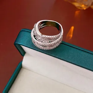 Minimalist multi-layer crisscross ring with zircons in a luxury silver-tone finish