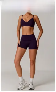 Detail view of grape purple yoga set with high-waist shorts and V-neck sports bra