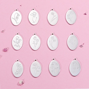 Polished stainless steel oval pendant necklace featuring twelve unique birthday flower engravings