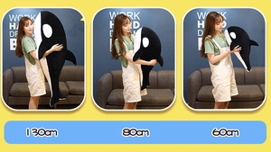 Orca plush toys comparison showing 130cm, 80cm and 60cm sizes against a yellow background