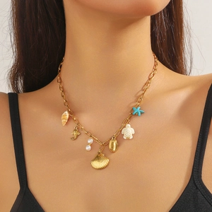Gold-plated stainless steel chain necklace featuring blue starfish and turtle charms