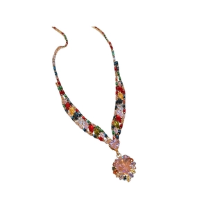 Colorful zircon heart pendant necklace in gold plating on a clean white background