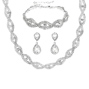 Elegant silver bridal jewelry set with sparkling crystals including necklace, bracelet, and earrings