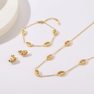 Detail of 18K gold-plated teardrop crystal necklace, bracelet, and earrings set