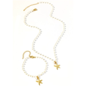 Ocean-inspired pearl necklace and bracelet set with golden starfish pendants