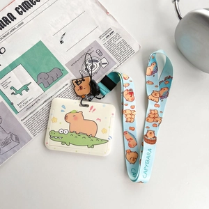 Detail of Capybara ID card holder with blue lanyard and cute cartoon illustration