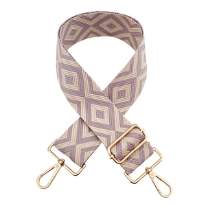 Close-up of lilac and cream jacquard diamond pattern strap with gold metal buckles
