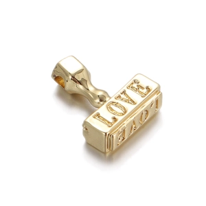 Macro shot of 18K gold-plated rectangular pendant with LOVE and MOM engravings