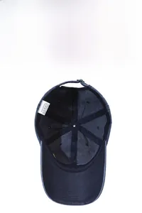 Detail of internal six-panel stitching and 100% cotton label on washed baseball cap