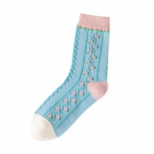 Sky blue crew socks with pink tulip flower embroidery and retro knitted textures