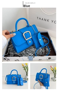 Blue lychee faux leather handbag detail with golden buckle and mini coin purse in gift box