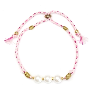 Detail of pink and white woven bracelet with pearls and adjustable sliding knot closure