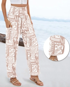 Detail of high waisted bohemian print trousers featuring side pockets and beach style