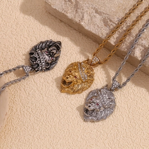 Three crown lion head pendants in gold, silver, and black finishes on twist chains