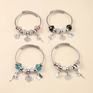 Detail of four colorful charm bracelets featuring crystal beads and diverse pendants