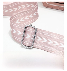 Close-up of adjustable pink and white jacquard strap with silver metal hardware