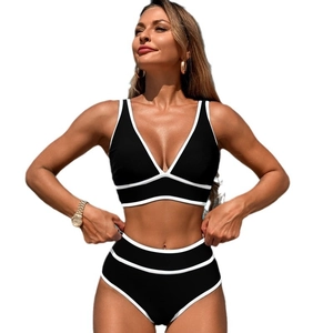 Two-piece black bikini with white contrast trim and high-waisted bottoms on white background