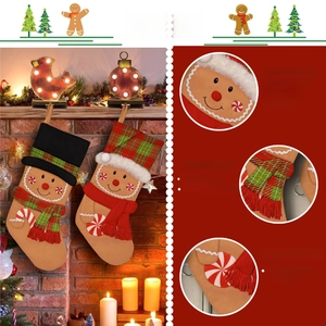 Close-up of gingerbread man Christmas stockings featuring embroidery and tassel details