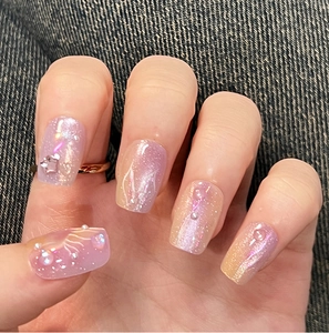 Macro detail of mermaid-style purple cat eye press-on nails with 3D jellyfish and pearls