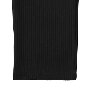 Detailed view of black ribbed knit fabric showing fine texture and elastic cuffs
