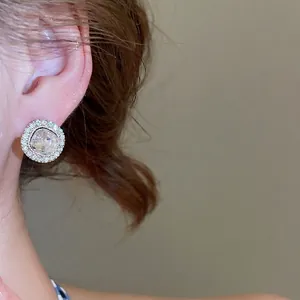 French style silver earrings with round sparkling cubic zirconia and elegant hollow spiral