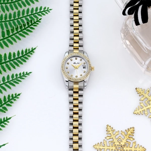 Close-up of luxury women's watch with crystals and date window in a gift setting