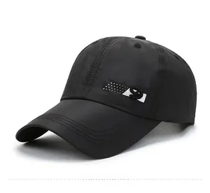 Detailed side view of black quick-dry baseball cap with white S logo and curved brim