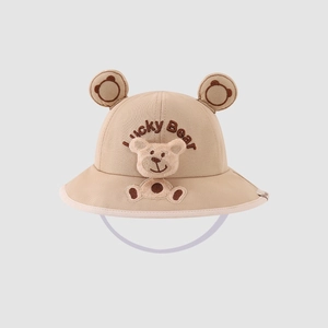 Detail of baby bucket hat featuring 3D plush bear and Lucky Bear embroidery with strap
