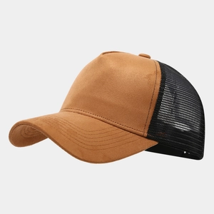 Close-up of brown faux suede and black mesh splicing detail on a baseball cap