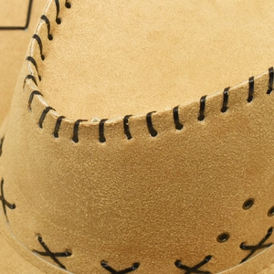 Brown faux suede western cowboy hat featuring black stitching and metal eyelets